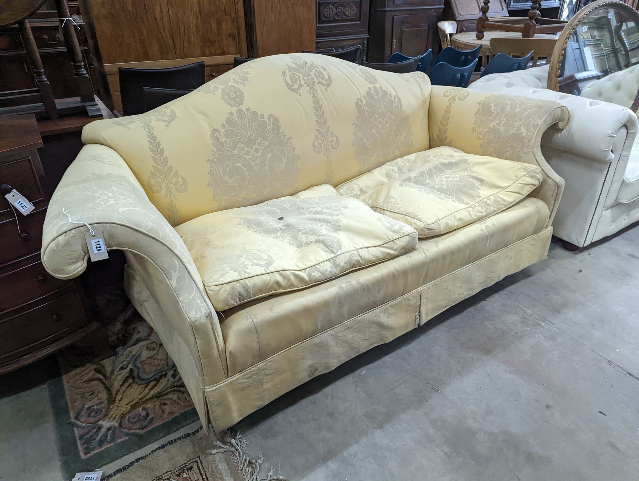 A George III style two seater upholstered scroll arm settee, length 200cm, depth 86cm, height 80cm